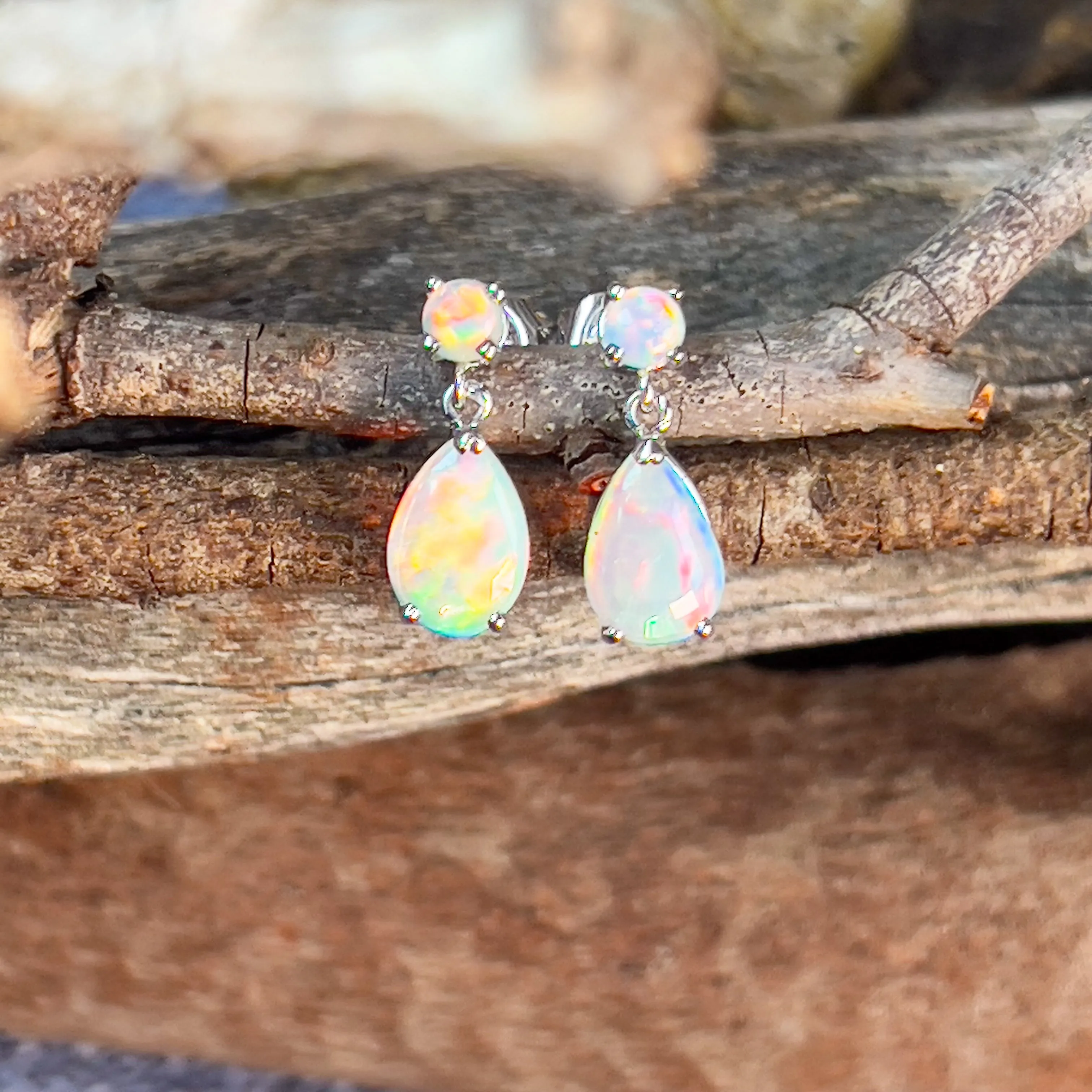 14kt White Gold pair of dangling Opal round and pearshape earrings