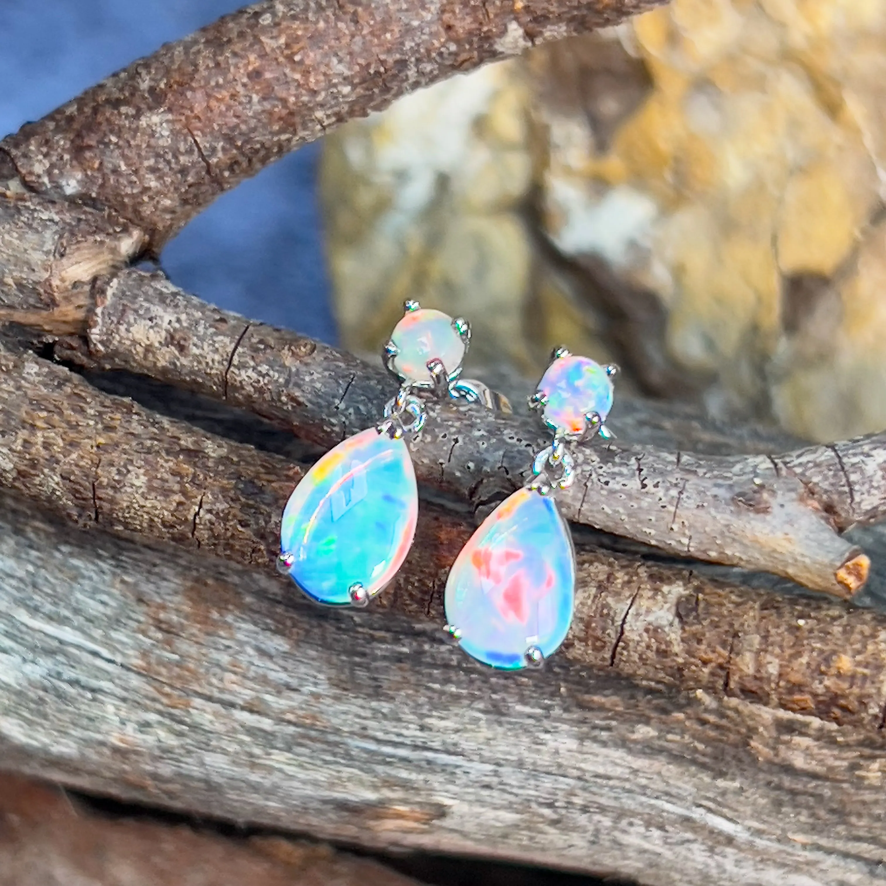 14kt White Gold pair of dangling Opal round and pearshape earrings