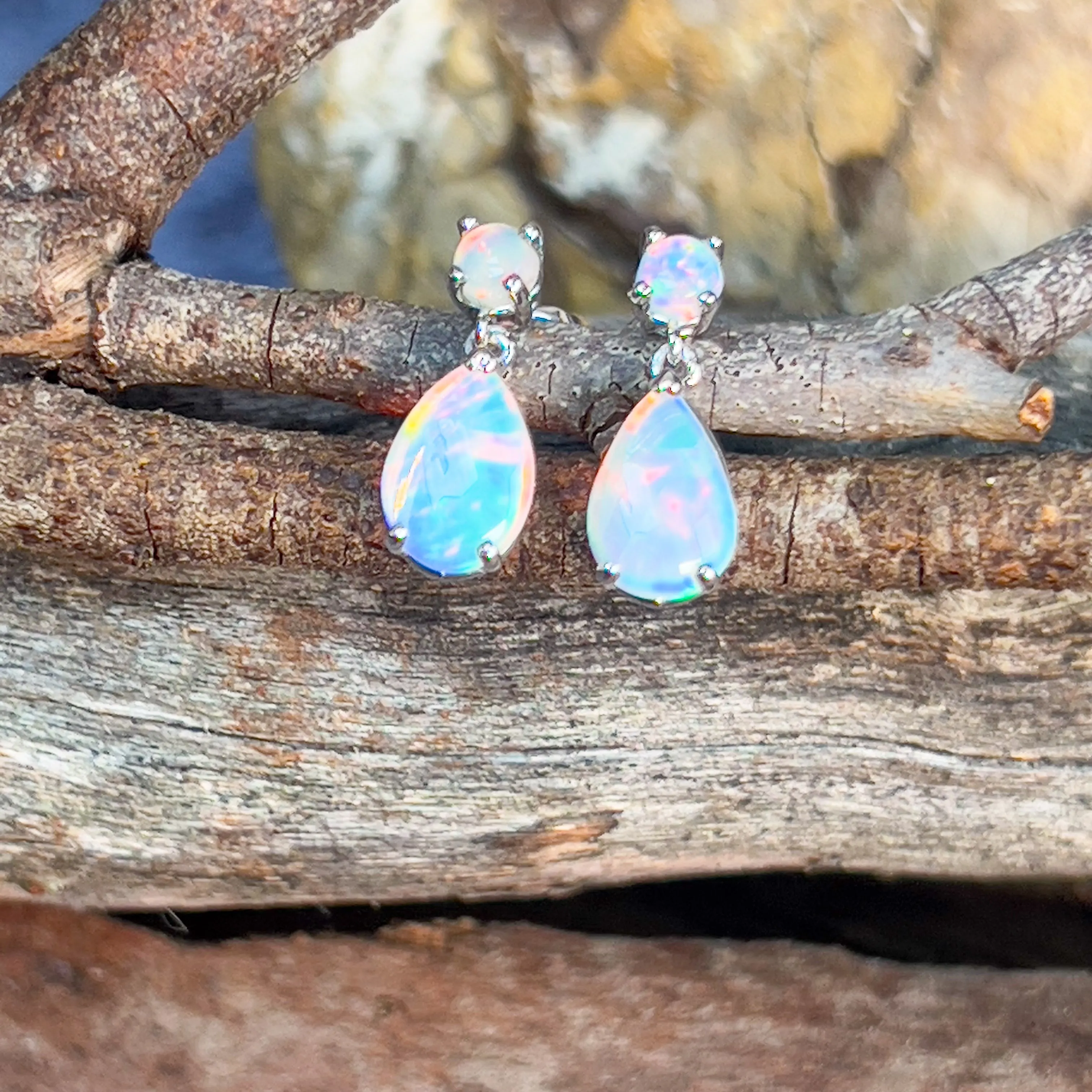 14kt White Gold pair of dangling Opal round and pearshape earrings