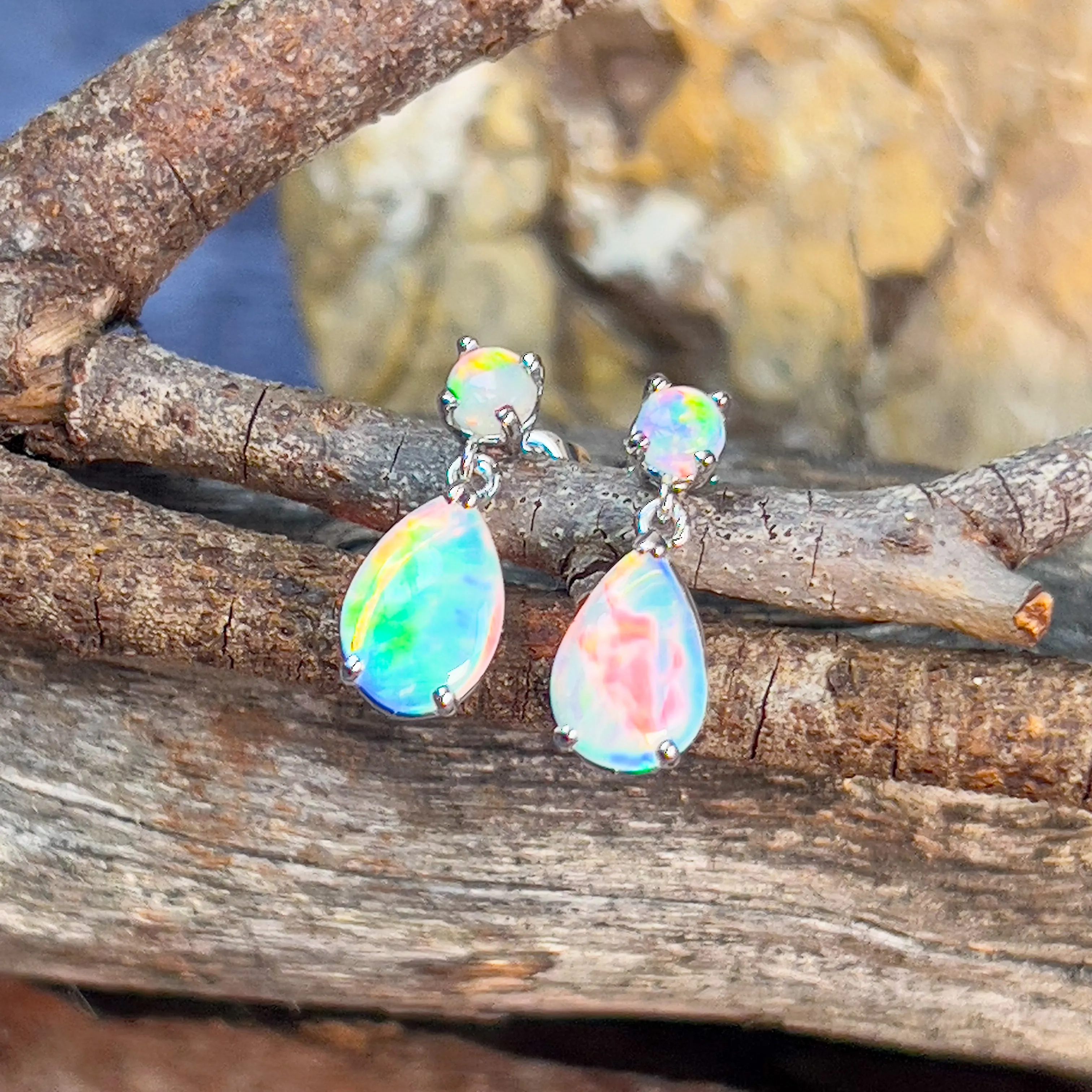 14kt White Gold pair of dangling Opal round and pearshape earrings