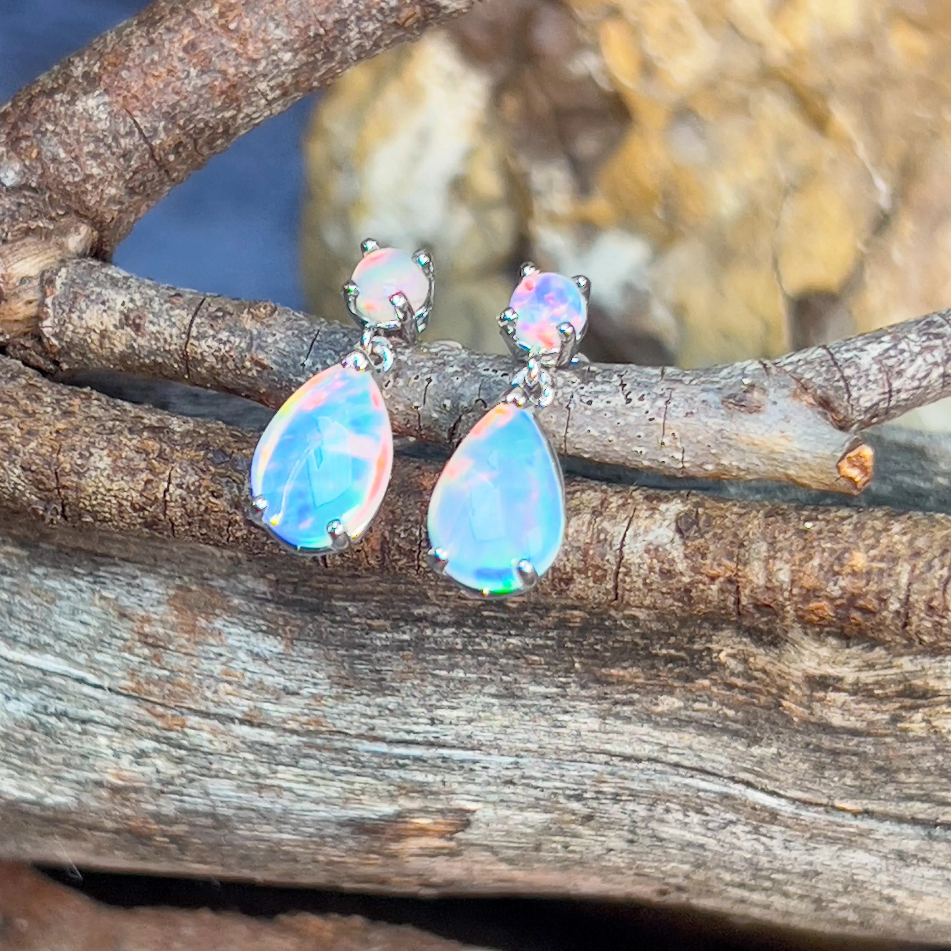 14kt White Gold pair of dangling Opal round and pearshape earrings