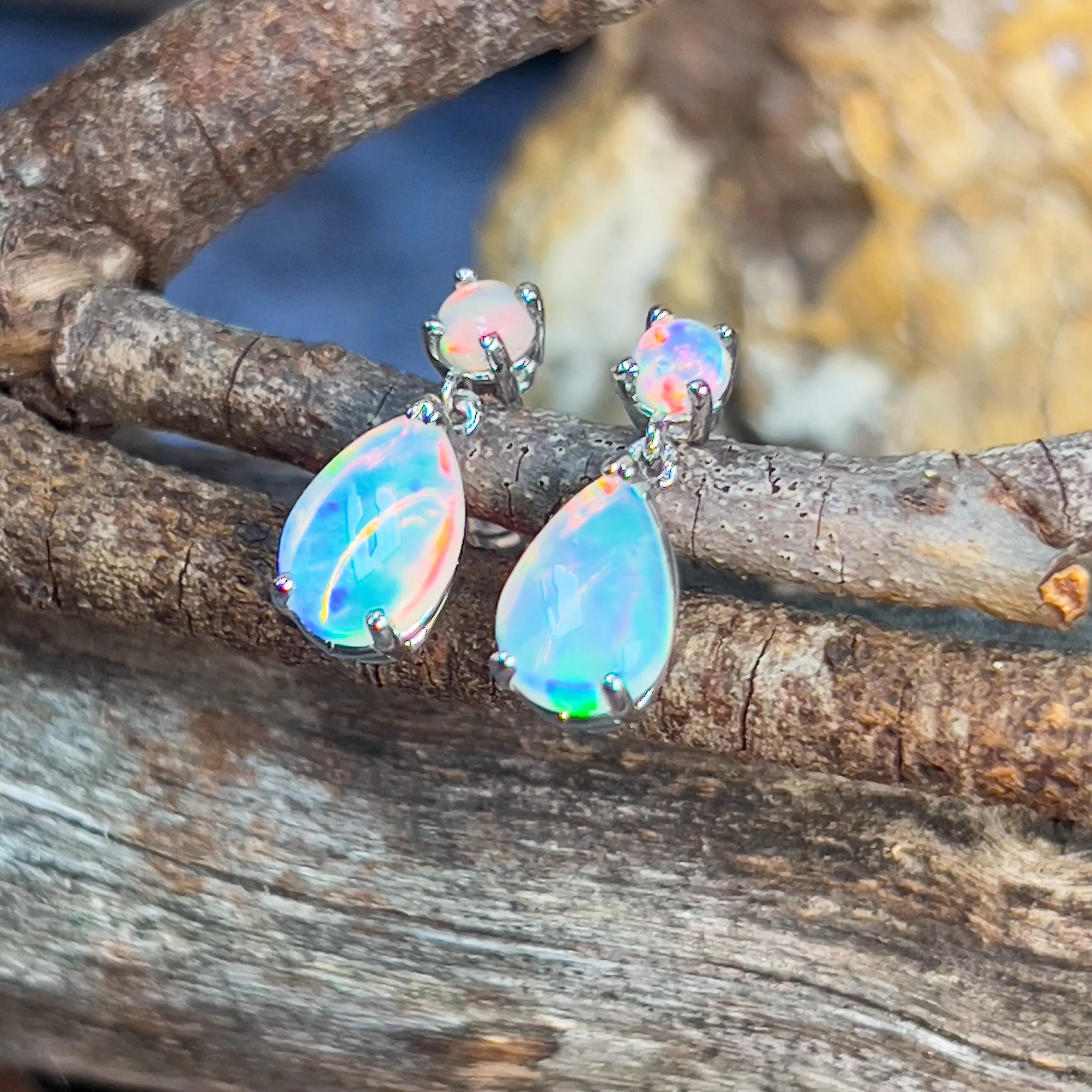 14kt White Gold pair of dangling Opal round and pearshape earrings